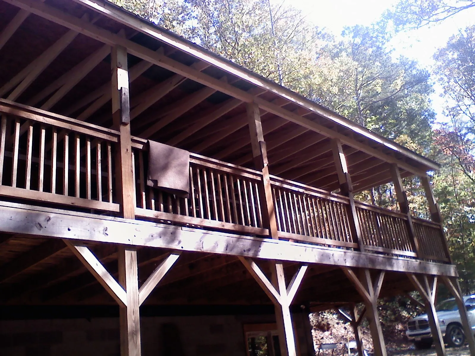 Timber framing under a new elevated porch and deck — Roof Leak Repair in Russia by Roofing Brothers